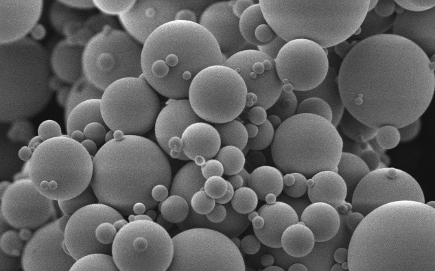 SUBJECT: Poly microspheres; CREDIT: Jian Hu (imaged by Kenneth Dunner Jr), UT MD Anderson Cancer Center; METHOD/INSTRUMENT: JEOL 5900, Platinum coated poly microspheres