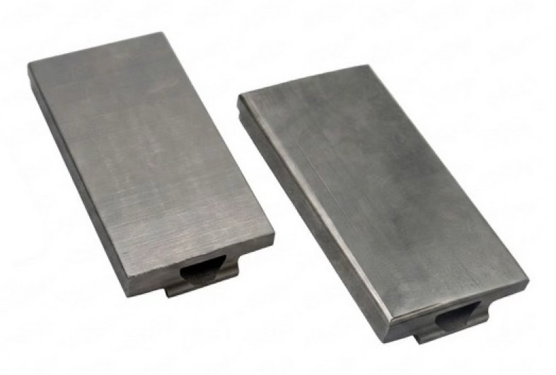 Finished flat and domed tungsten tiles with mirror-like plasma-facing surfaces, ready for installation in DIII-D.