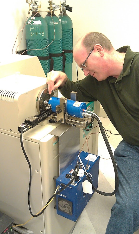Conducting analysis with the AccuTOF-DART in the Armitage lab.