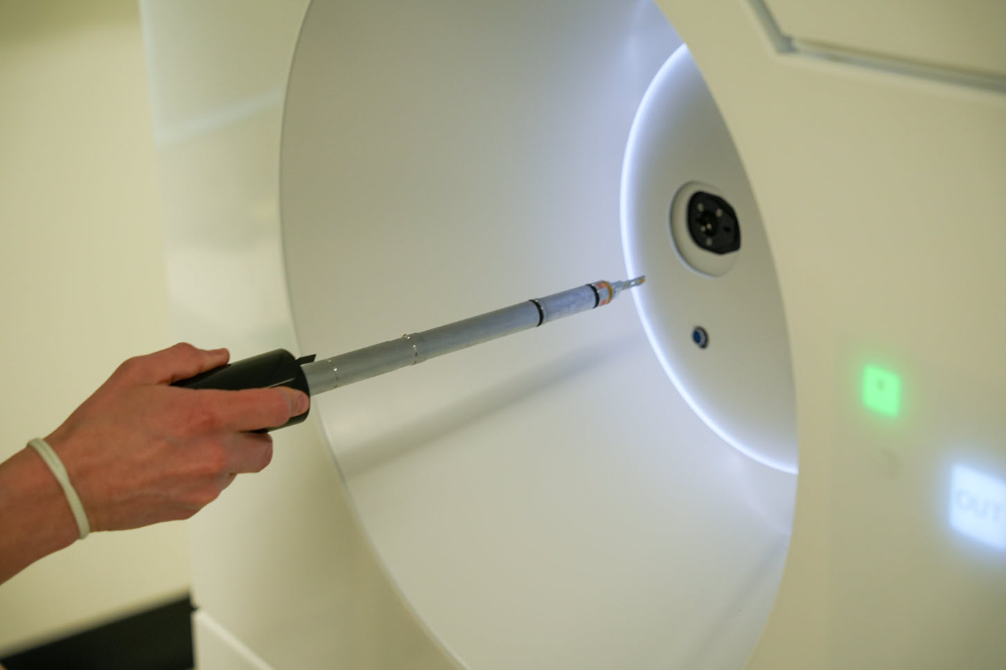 Lucy Gordon inserting sample holder into the JEM-120i